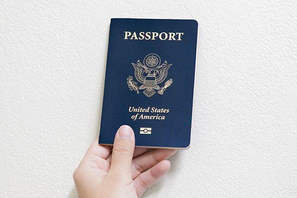 hand holding an American passport
