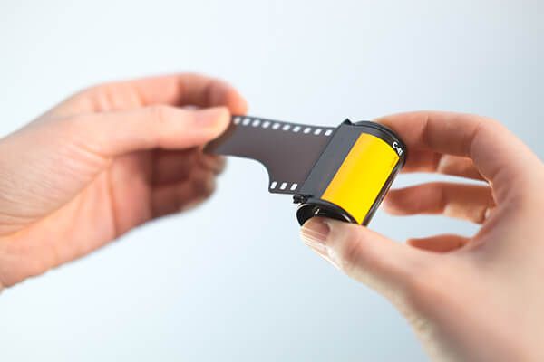 hand holding a photo camera film