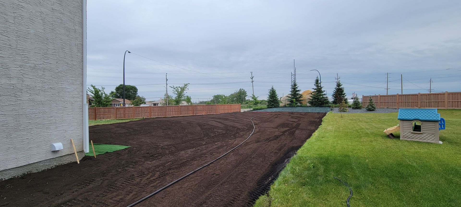 Land grading and soil preparation for new hydroseeding project