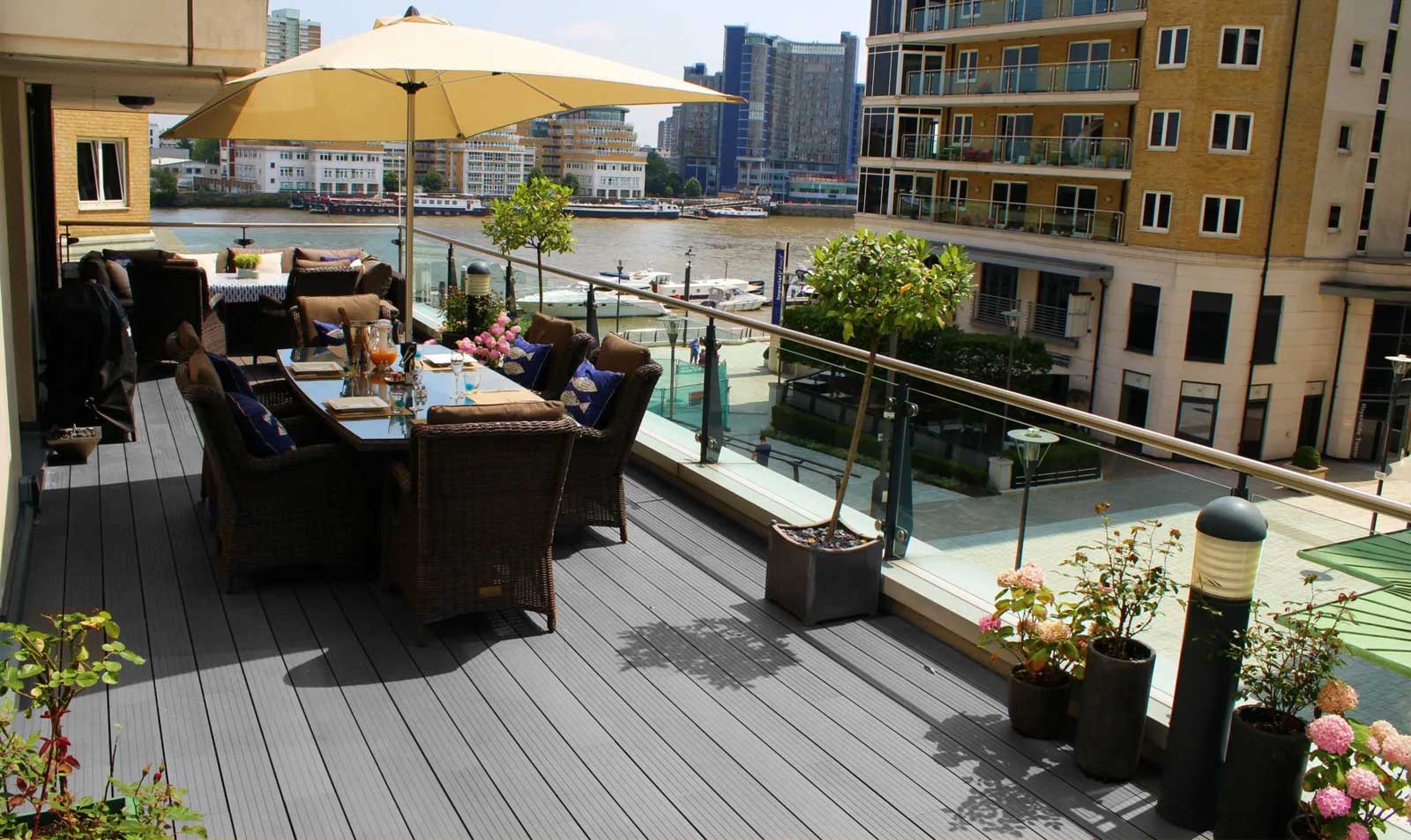 Timber decking on a balcony with rattan decking furniture