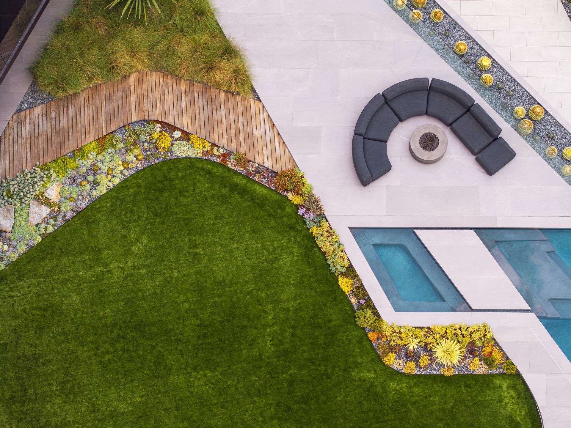 Sunny garden path with palm trees, shrubs, and stone stepping slabs leading through a landscaped courtyard.