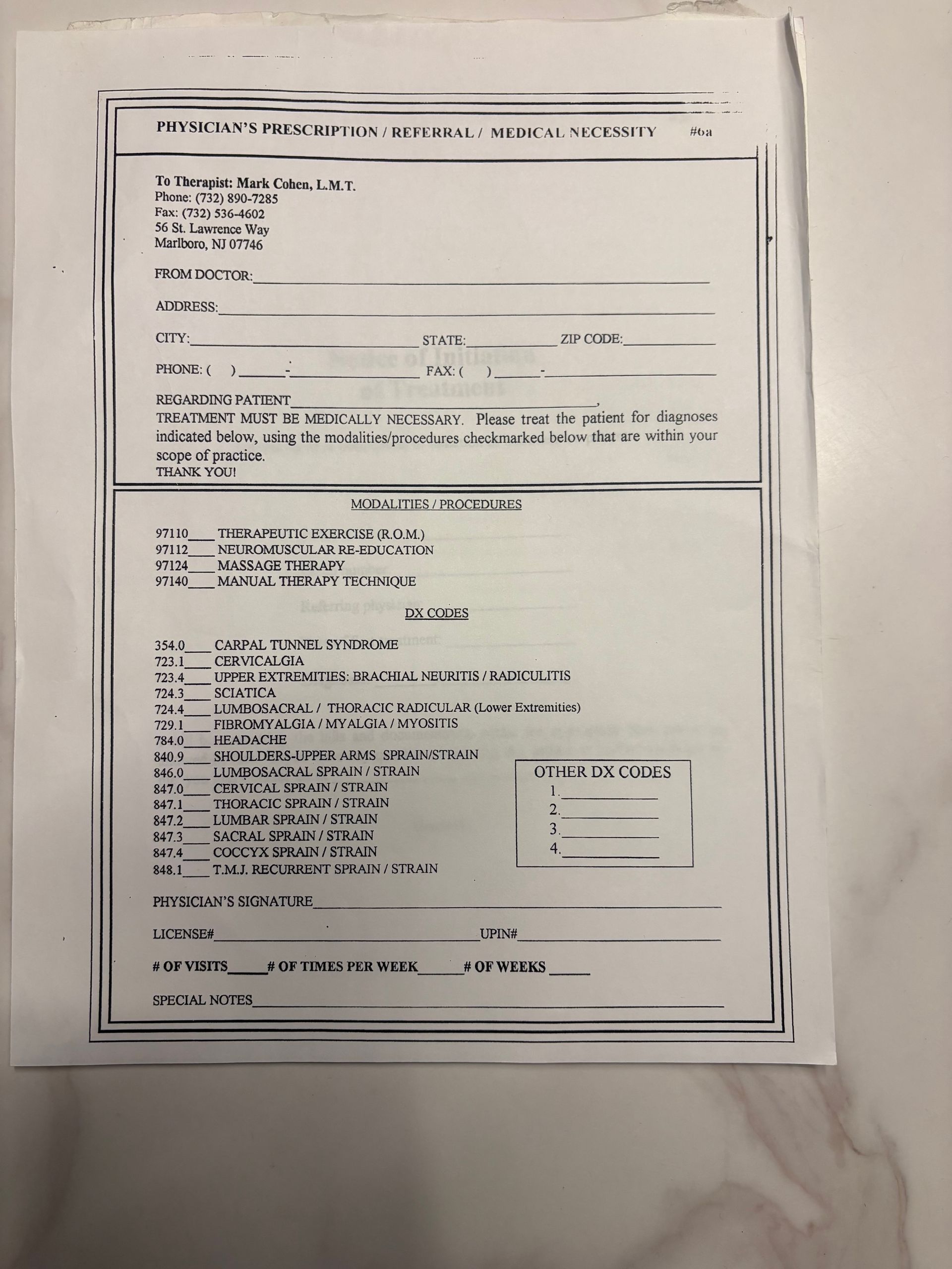 A printed document with a checklist, likely for a healthcare assessment, on a white surface.