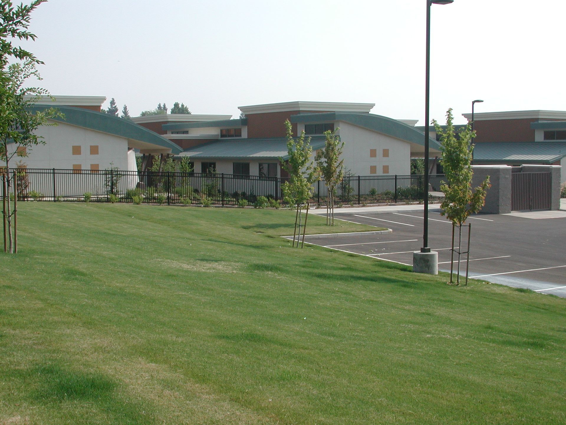a large building with a lot of grass in front of it
