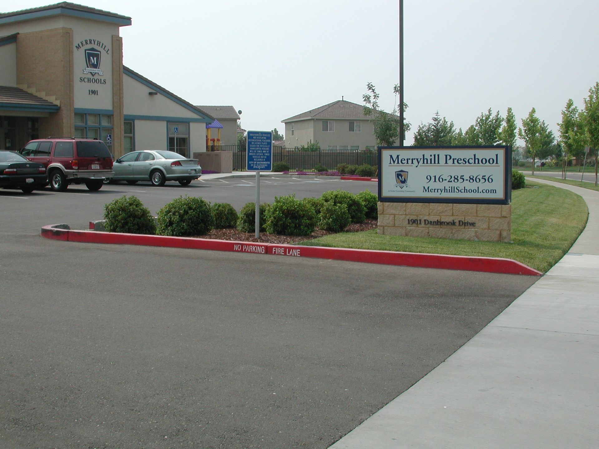 a parking lot with a sign that says merrill presbyterian
