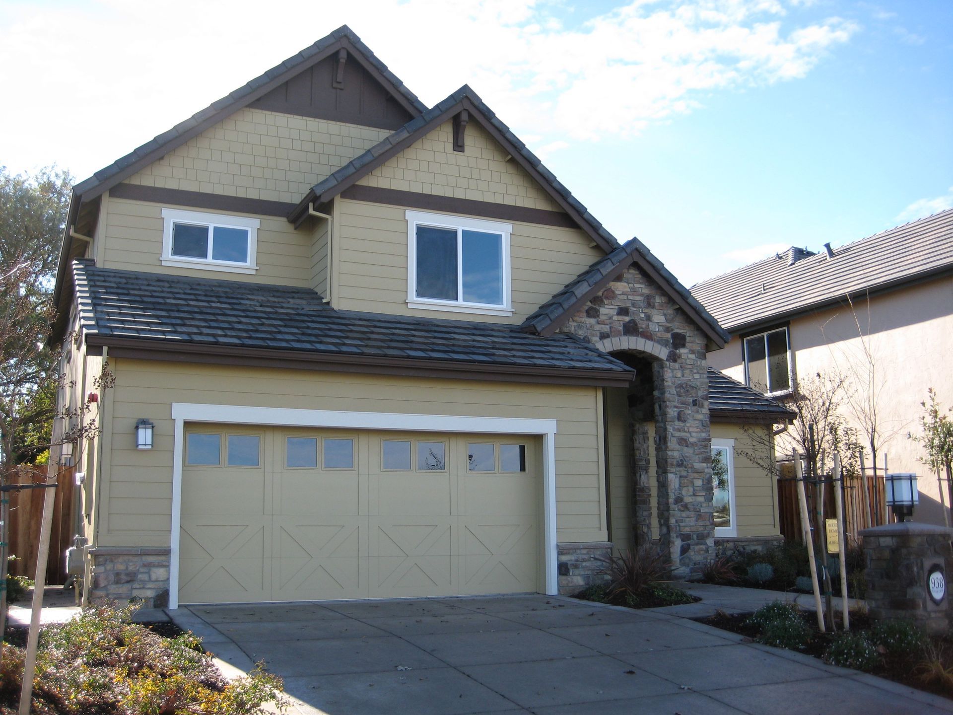 the front of a house with a large garage door