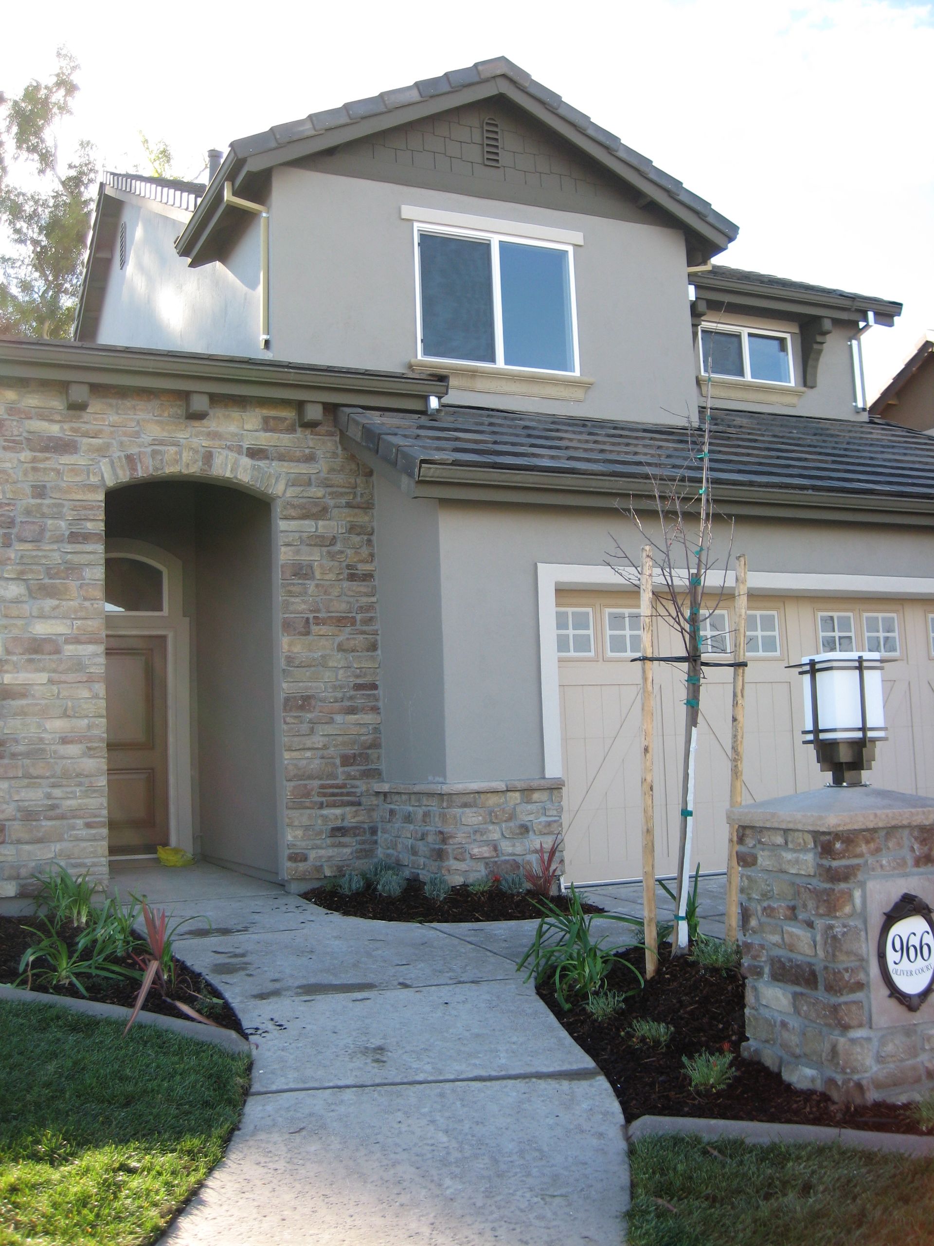 a large house with a walkway leading to it