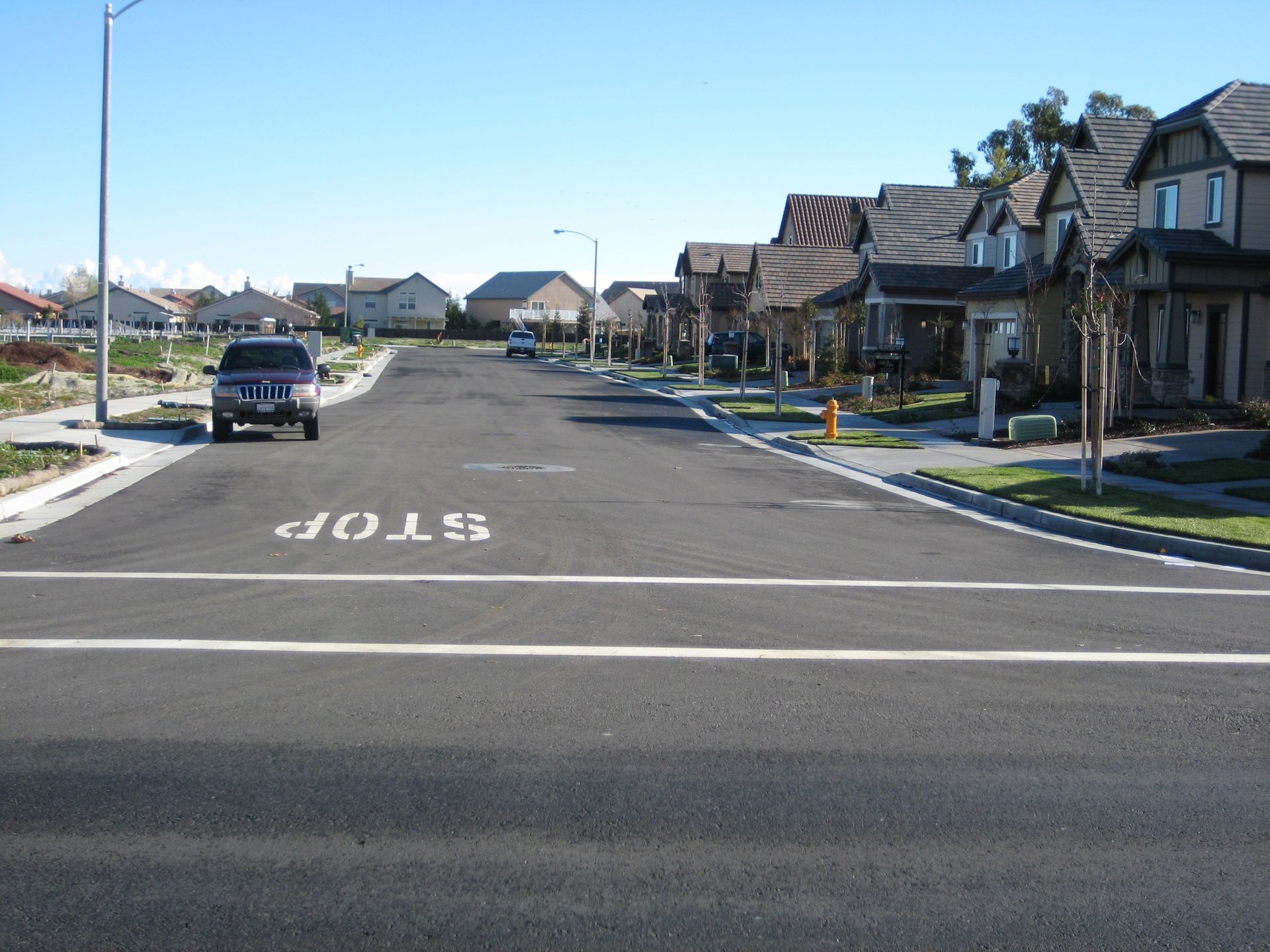 a stop sign is painted on the side of the road