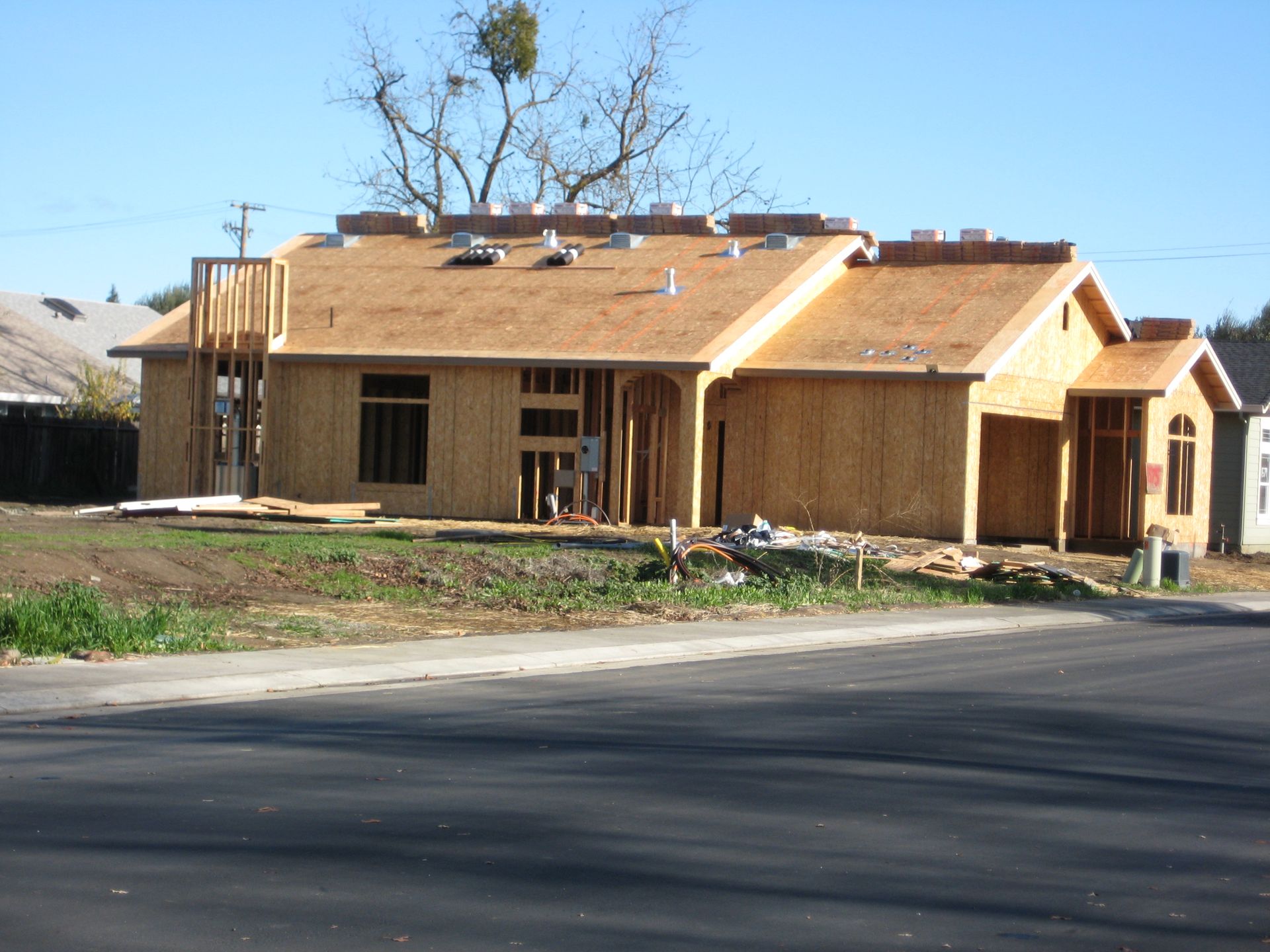 a house that is being built in a residential area