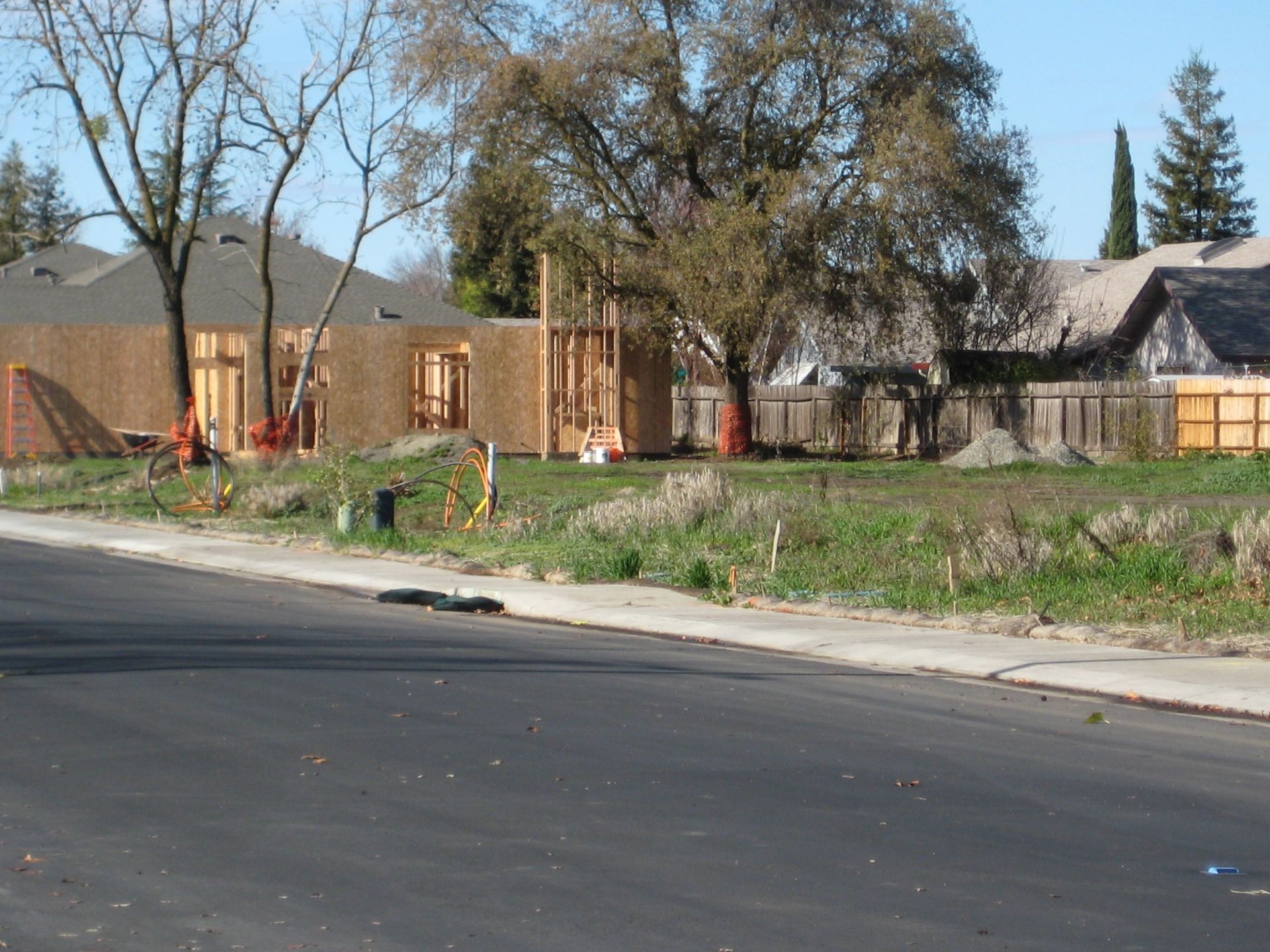 a house is being built on the side of the road