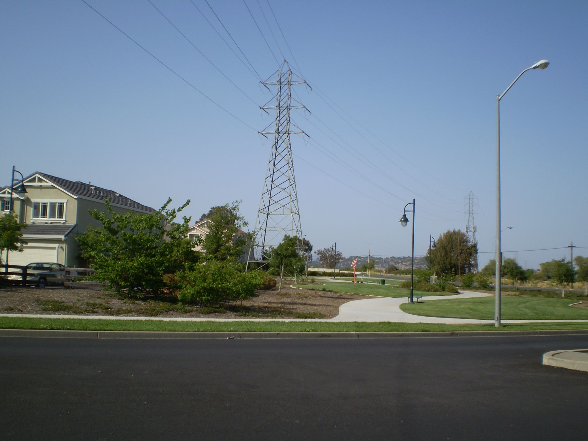 a street with a telephone pole in the background