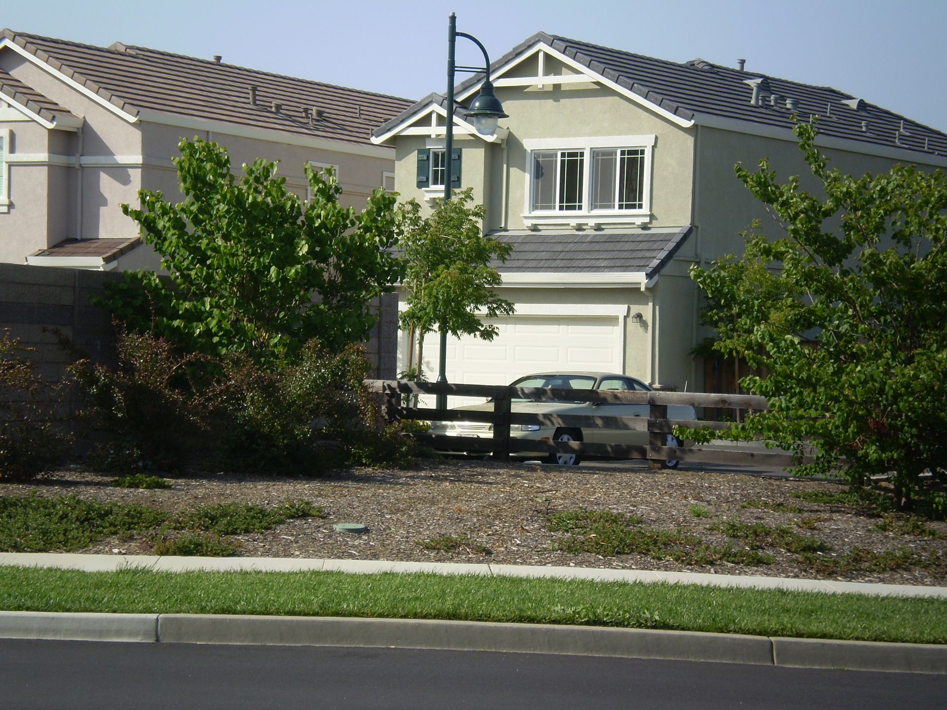 a white truck is parked in front of a house