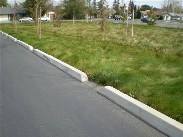 a road with a grassy area on the side of it