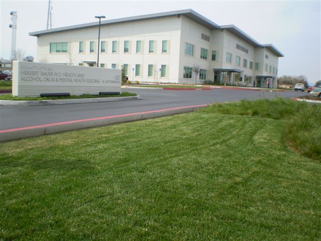 a large white building with a sign in front of it