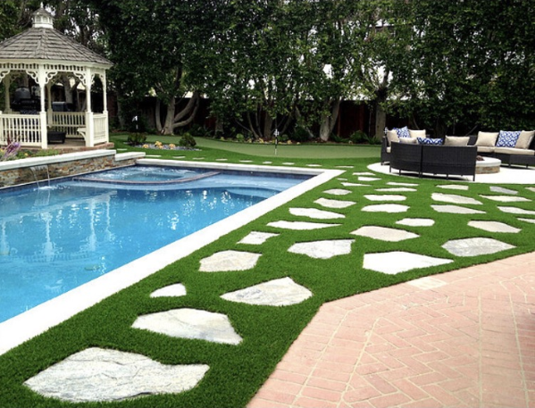 step stones, pool and artificial grass