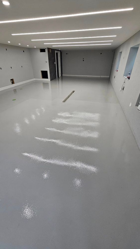 A large room with a gray floor and white walls.