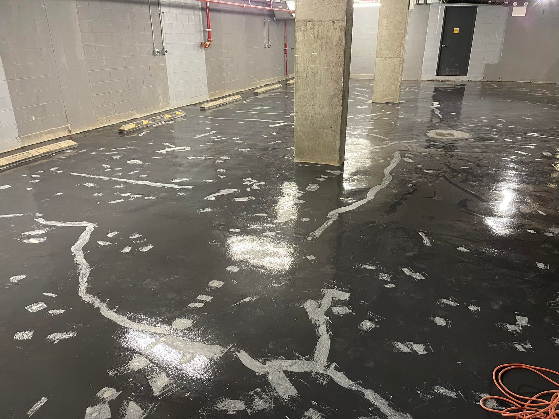 A concrete floor with a lot of cracks in it