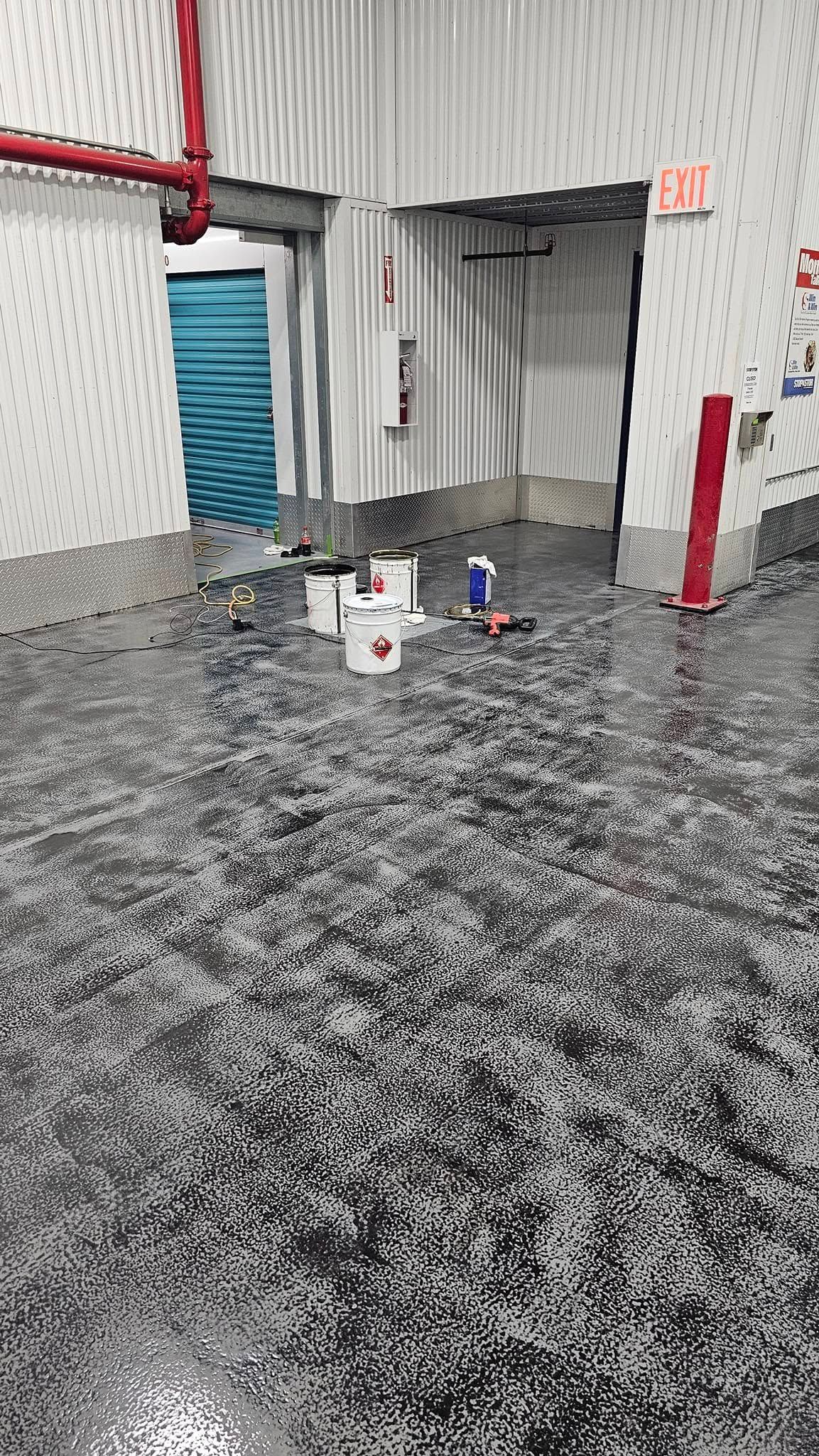 A warehouse with a lot of buckets on the floor.