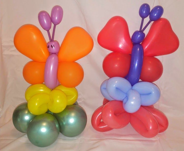 Two butterflies made out of balloons are sitting next to each other