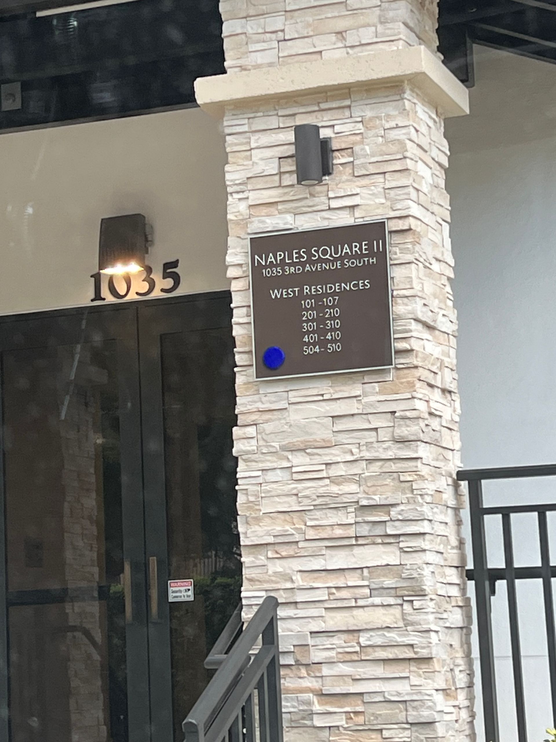 Exterior of building at 1035, with sign 