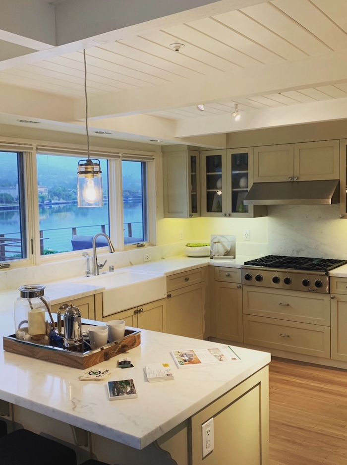 There is a large island in the middle of the kitchen.