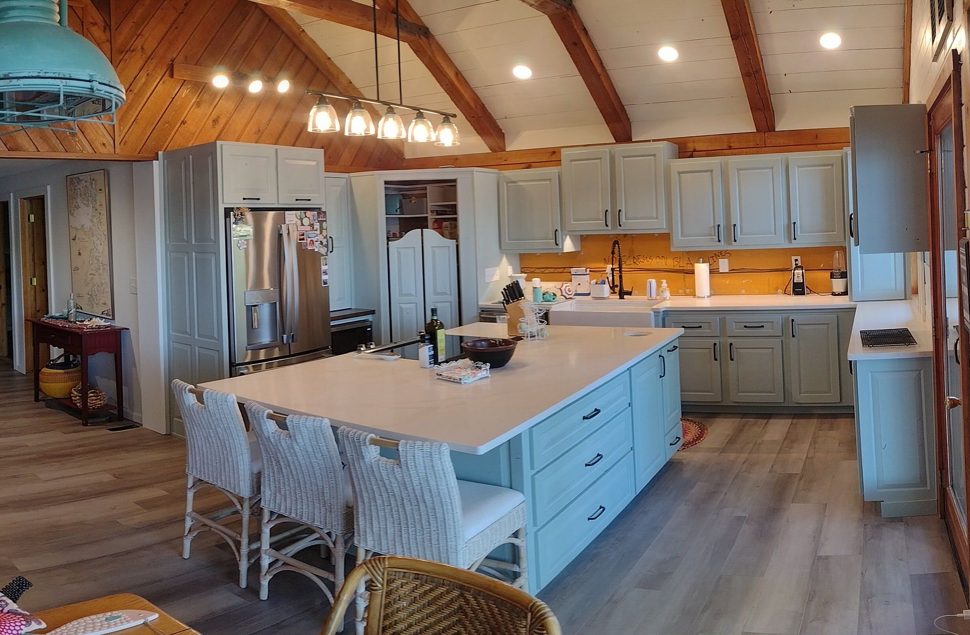 There is a large island in the middle of the kitchen.