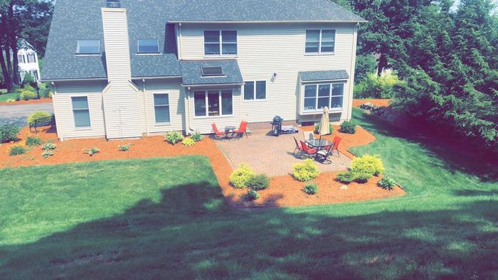 Garden With Table And Chair — Shrewsbury, MA — Warren Landscaping