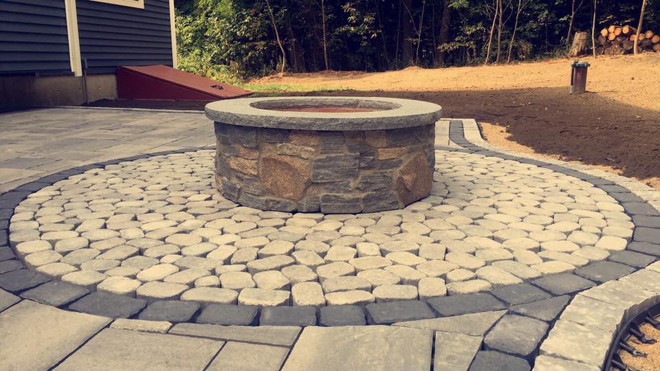Finished Backyard Lawn With Ready Fountain In Middle — Shrewsbury, MA — Warren Landscaping