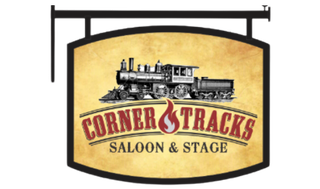 A sign for corner tracks saloon and stage with a train on it.