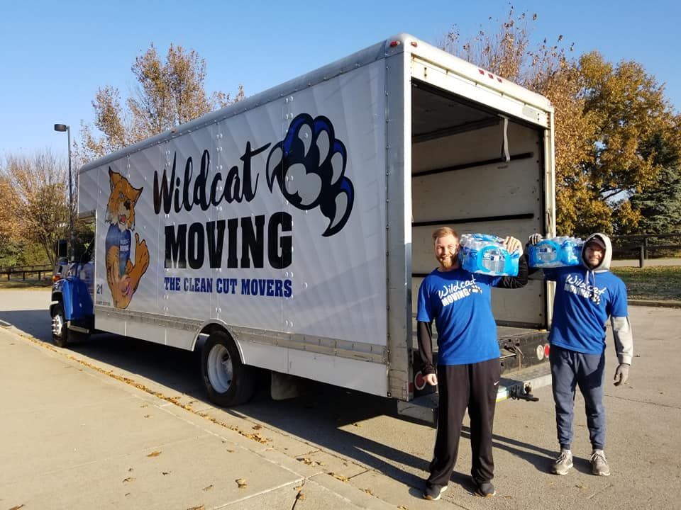 A Group of People Standing Beside the Truck - Lexington, KY - Wildcat Moving
