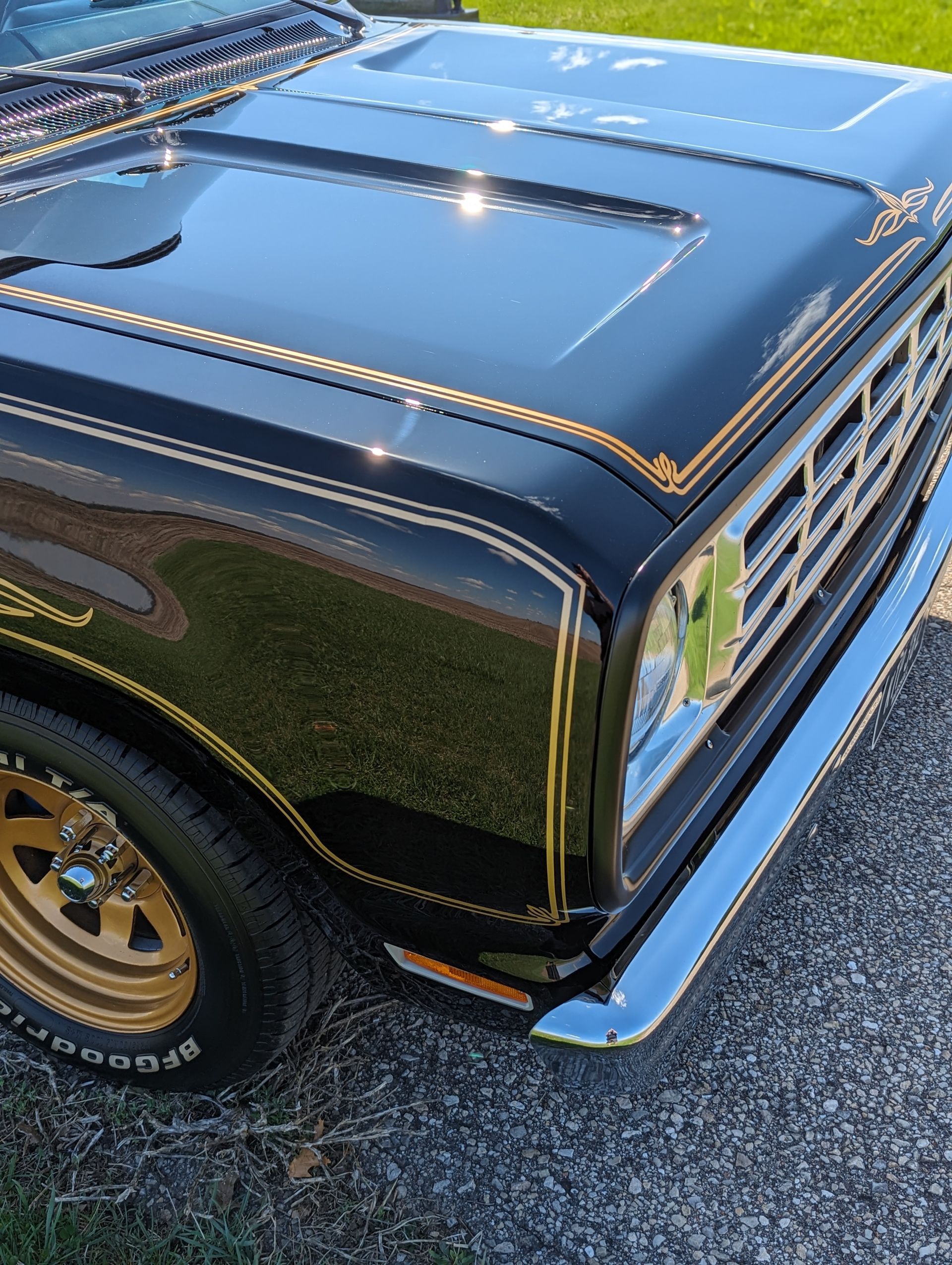 A black car with a hood that says bfgoodrich on it