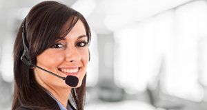 Young smiling lady wearing telephone headset