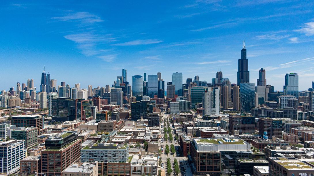 An aerial view of a city skyline on a sunny day in West Loop.