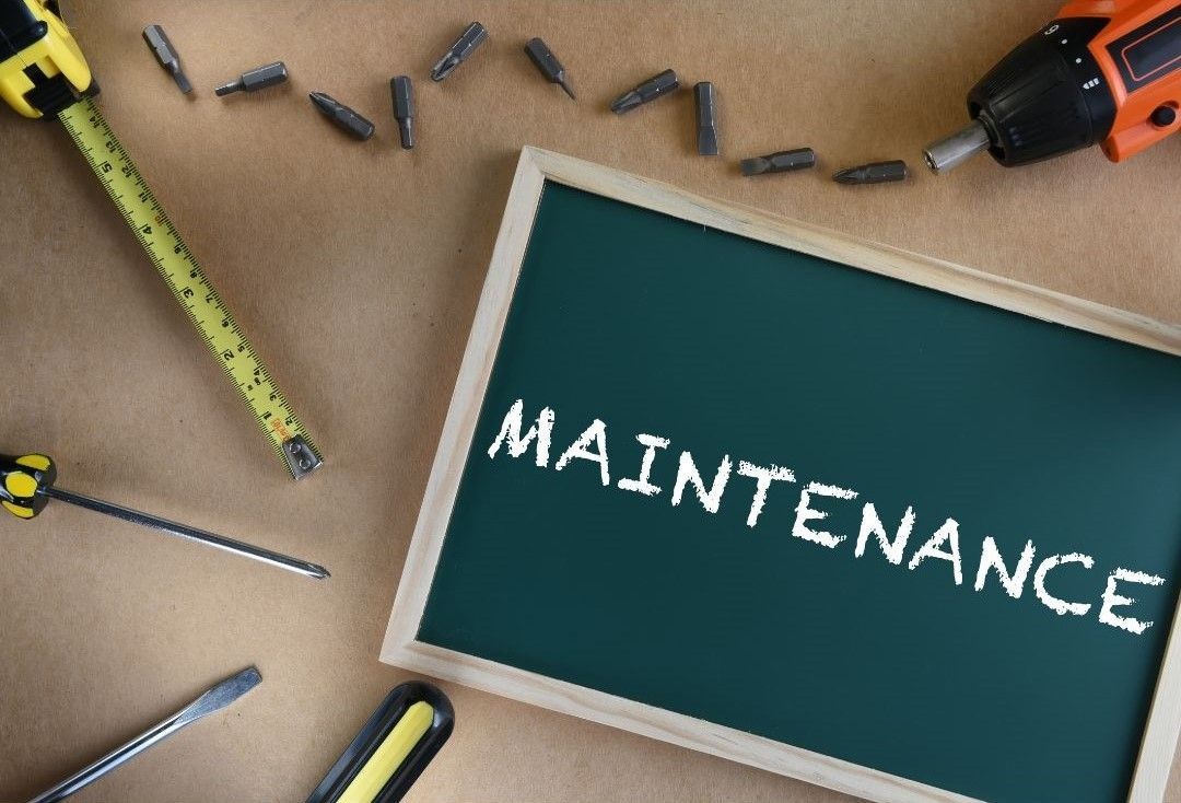 A chalkboard with the word maintenance written on it