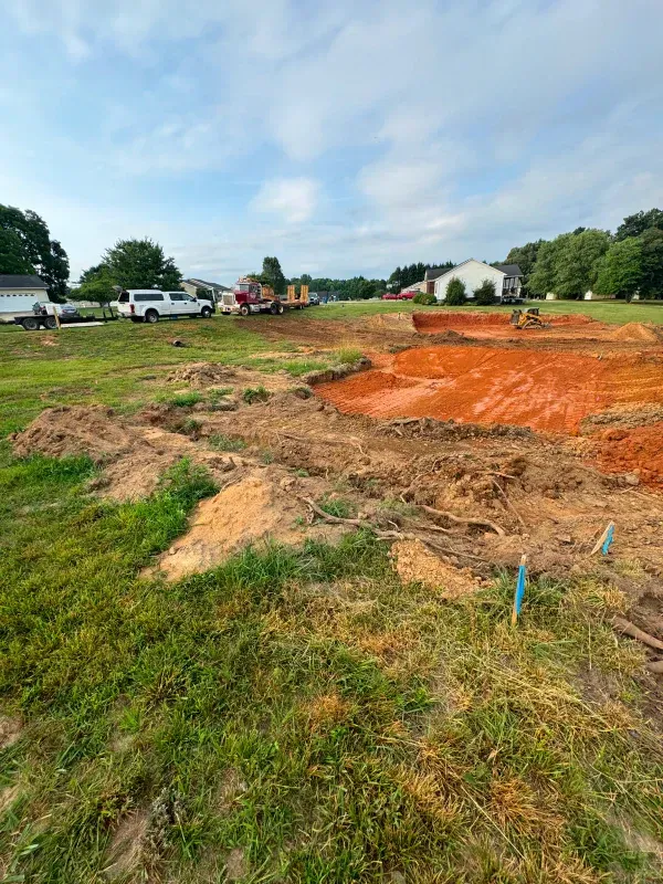 There is a lot of dirt in the middle of a field.