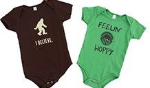 Infant apparel black and green with logos