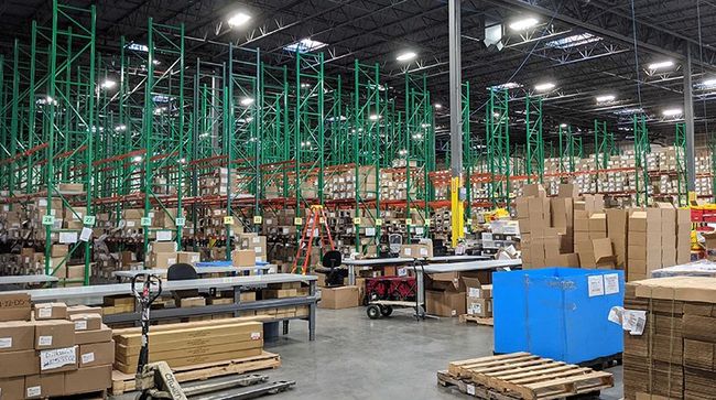 NLRP warehouse racks and packing tables
