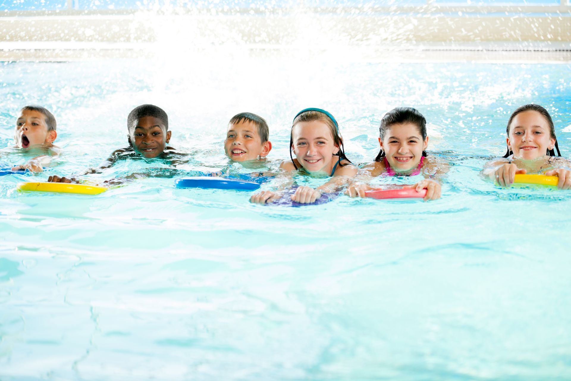 A group of children are swimming in a swimming pool-Swim School In Valentine, NSW