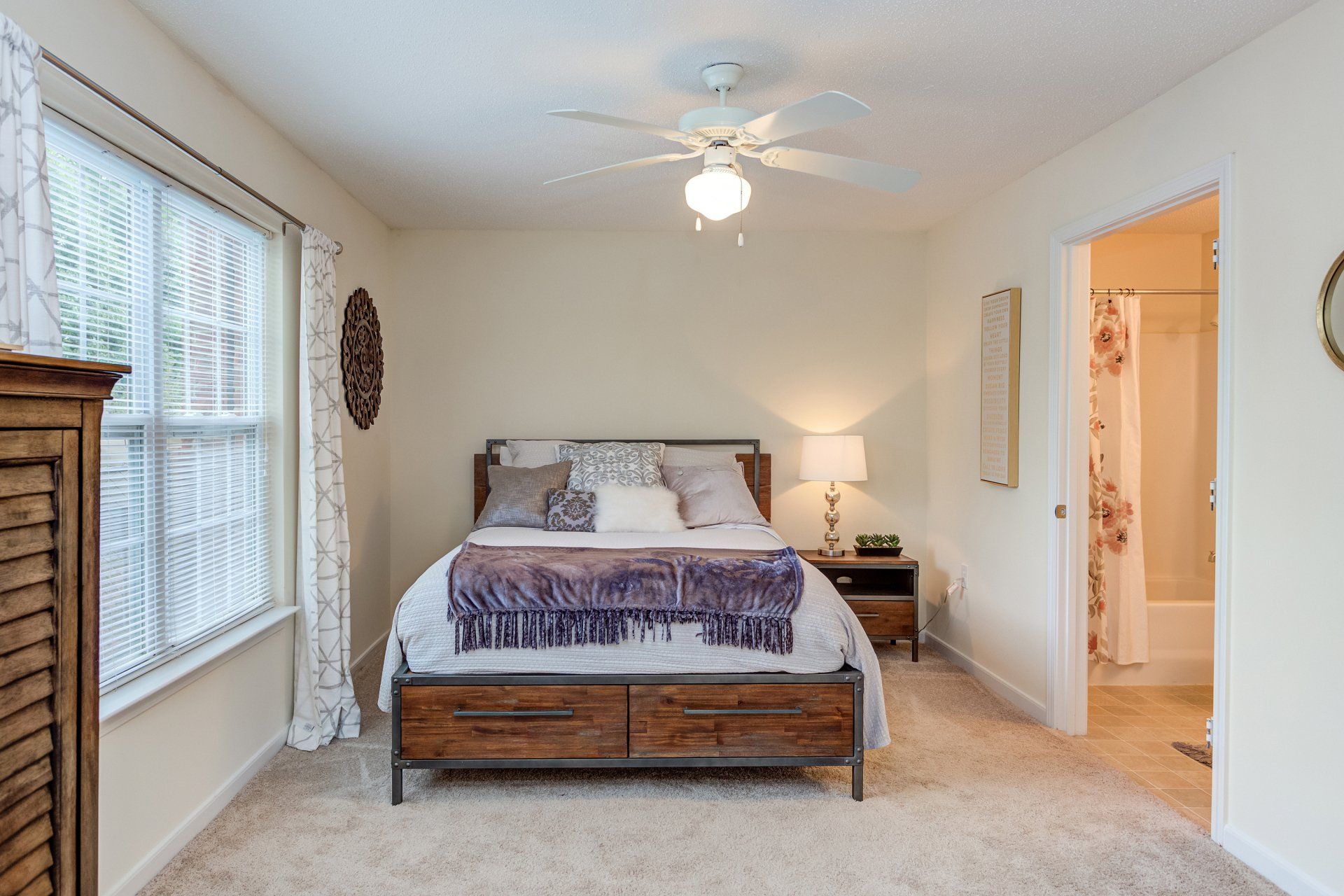 A bedroom with a bed and a ceiling fan at Morgan Ridge.