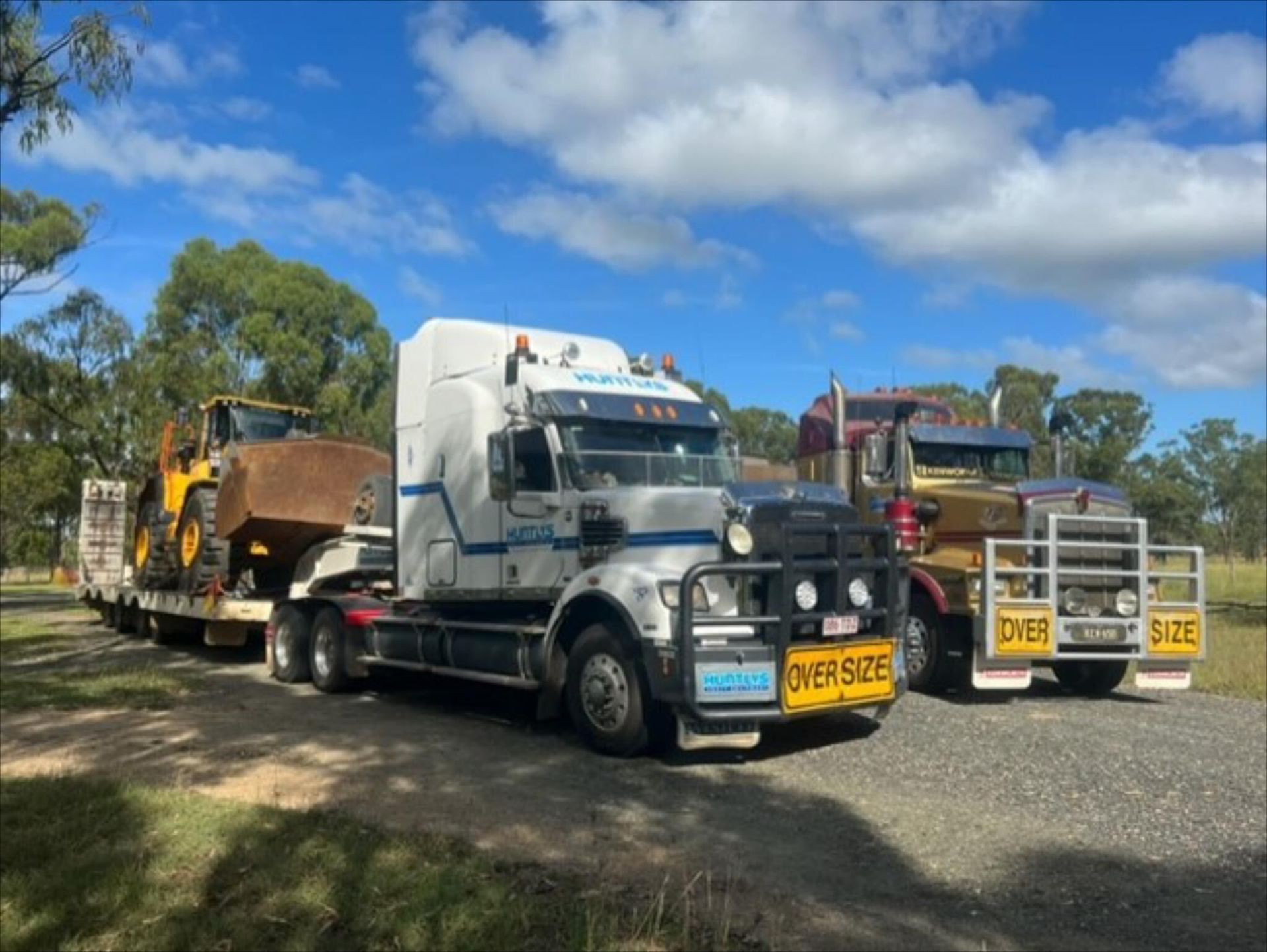 Three Semi Trucks Are Parked Next to Each Other on a Dirt Road — Advanced Civil Earthworks In Innisfail, QLD