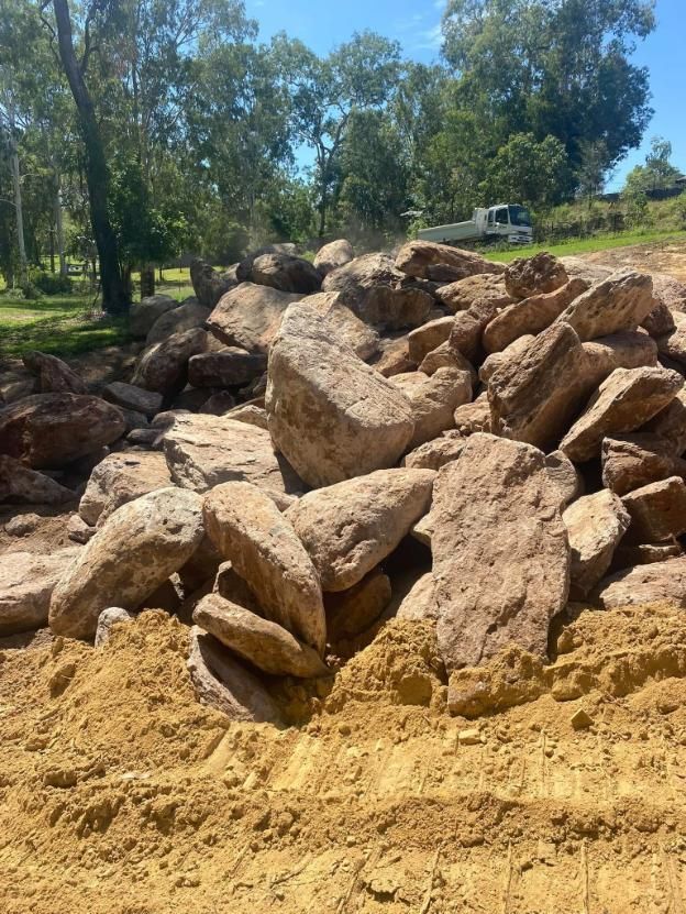 A Pile of Rocks Sitting on Top of a Pile of Dirt — Advanced Civil Earthworks In Koah, QLD