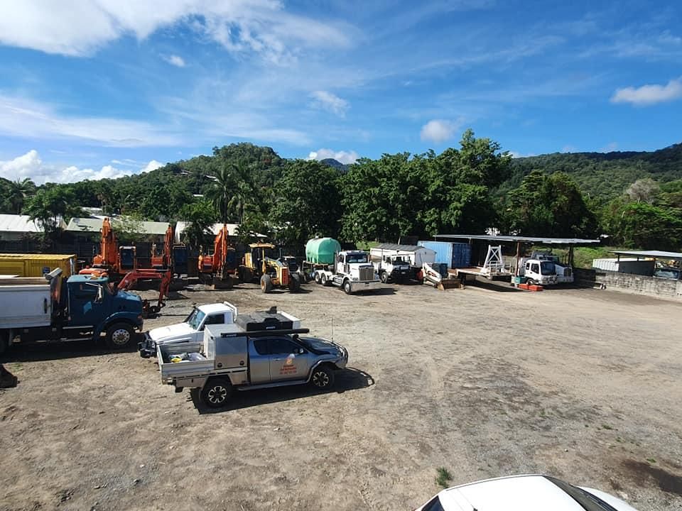A Lot of Trucks Are Parked in a Dirt Lot — Advanced Civil Earthworks In Cape York, QLD