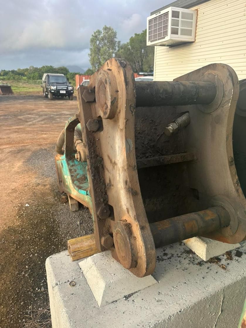A Large Piece of Metal is Sitting on Top of a Concrete Block — Advanced Civil Earthworks In Koah, QLD