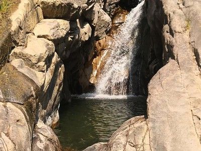 A waterfall in the middle of a rocky area
