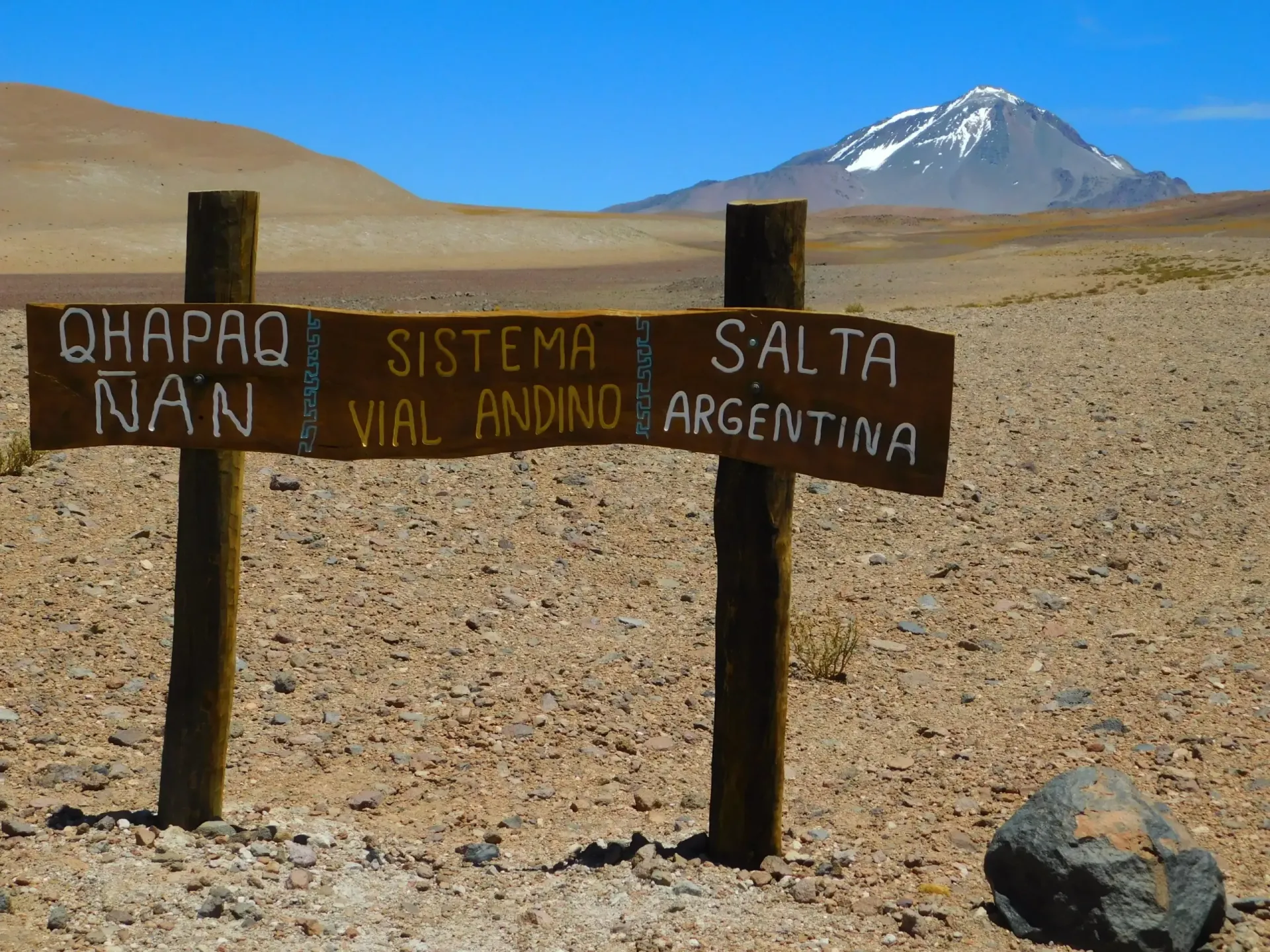 A sign in the desert says qhapaq nan sistema vial andino salta and argentina