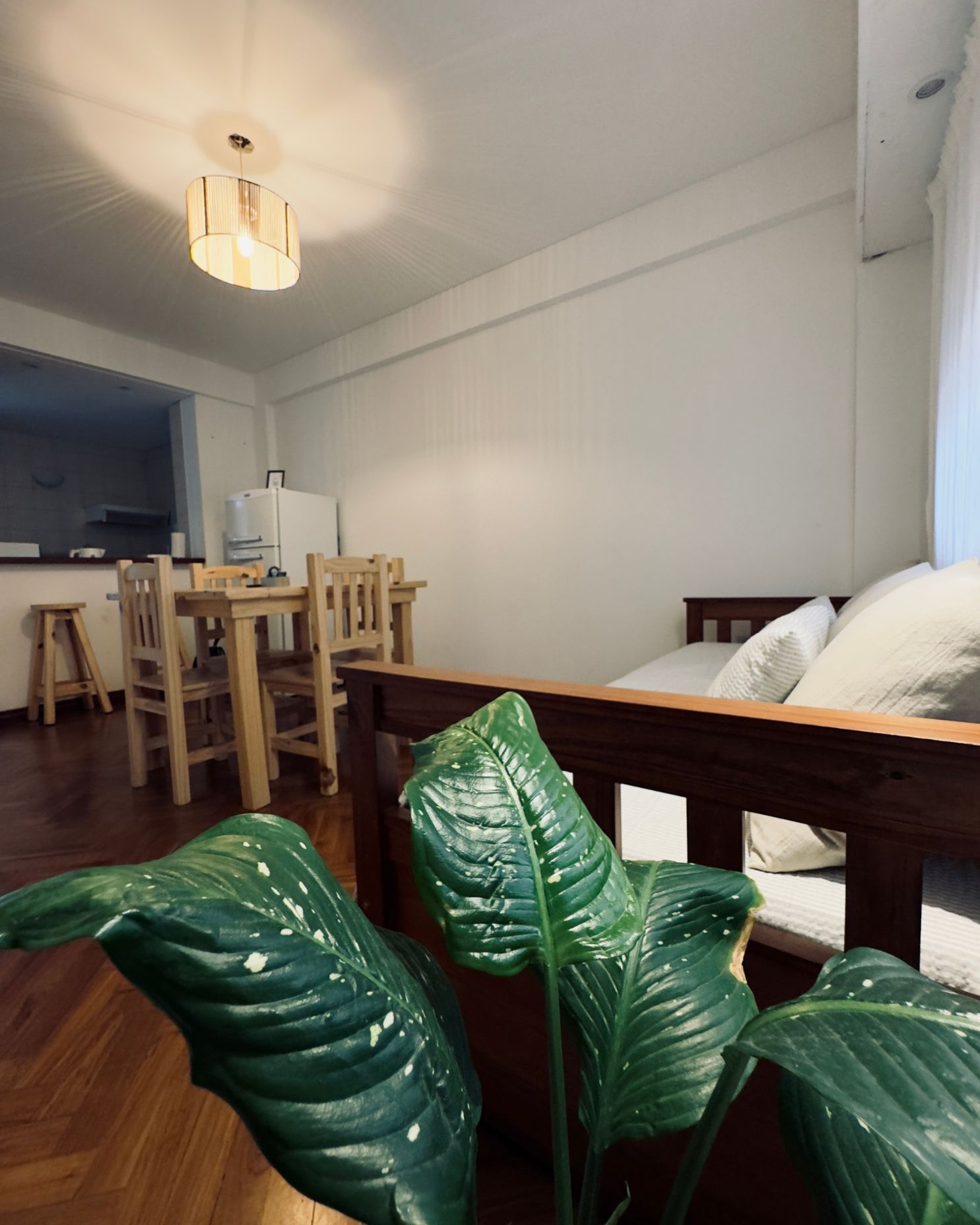 A living room with a couch a table and chairs