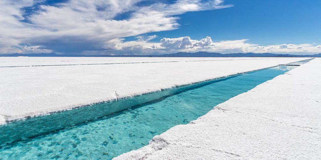 There is a river running through the middle of the salt lake.