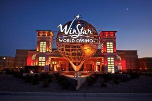 The winstar world casino is lit up at night