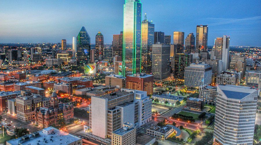 An aerial view of a city skyline at night.