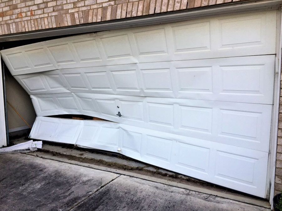 garage door with large dent
