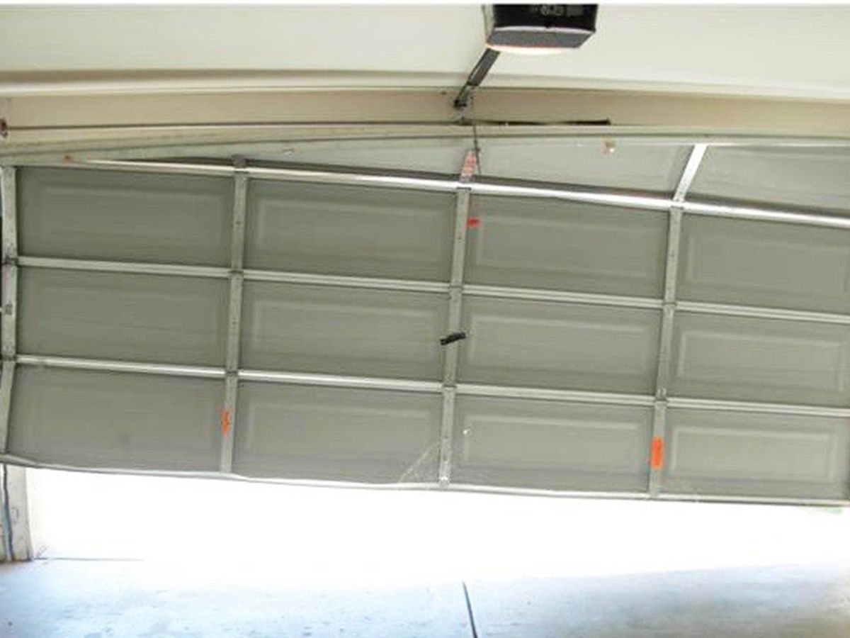Garage door off track and hanging uneven